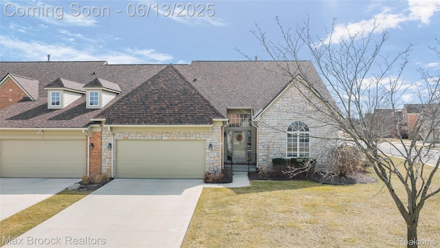 37143 Southwind Ct Unit 38, Farmington Hills, MI 48331 - french country home featuring driveway, an attached garage, roof with shingles, and a front lawn