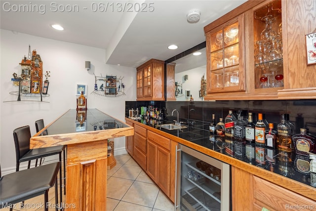 37143 Southwind Ct Unit 38, Farmington Hills, MI 48331 - indoor wet bar featuring wine cooler, light tile patterned flooring, recessed lighting, and tasteful backsplash
