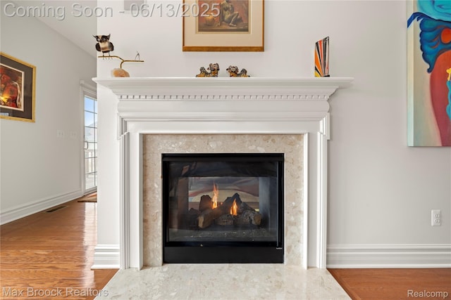 37143 Southwind Ct Unit 38, Farmington Hills, MI 48331 - detailed view of a high end fireplace, wood finished floors, and baseboards