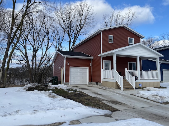 view of front facade with a garage and covered porch