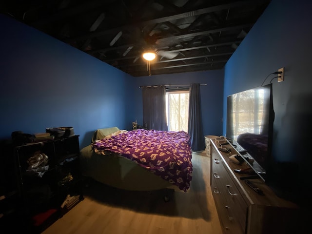 bedroom with hardwood / wood-style flooring and ceiling fan