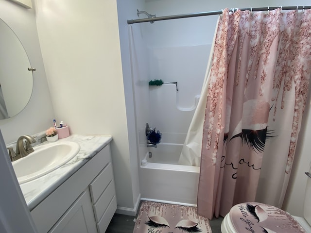 full bathroom featuring vanity, shower / tub combo with curtain, and toilet