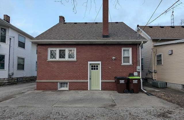 rear view of house featuring central AC and a patio