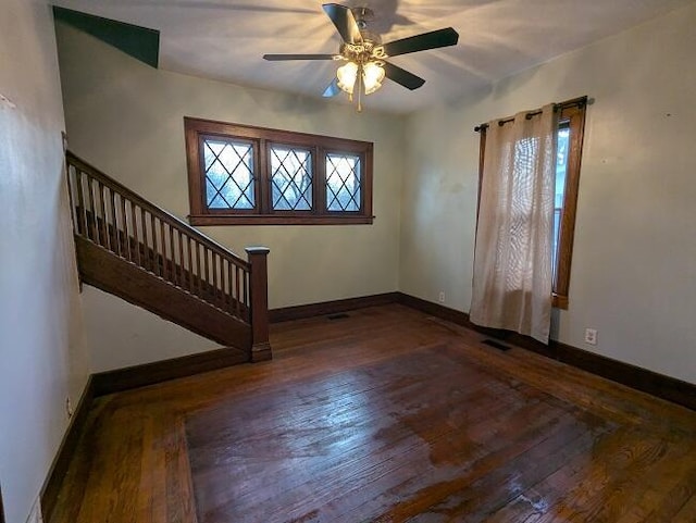 entrance foyer with dark hardwood / wood-style floors and ceiling fan