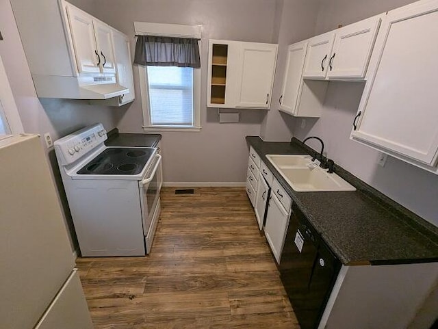 kitchen featuring sink, electric range, fridge, black dishwasher, and white cabinets