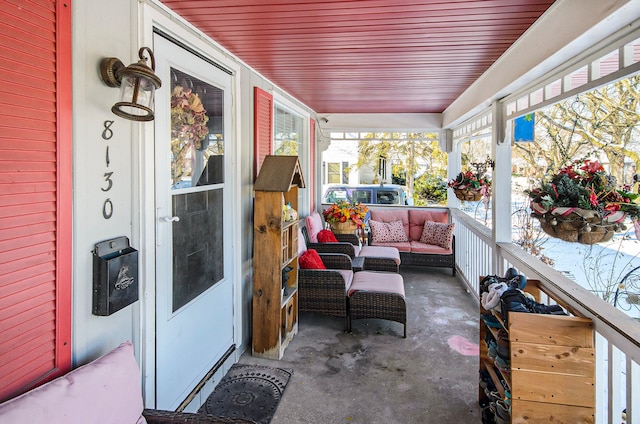 sunroom / solarium featuring wood ceiling