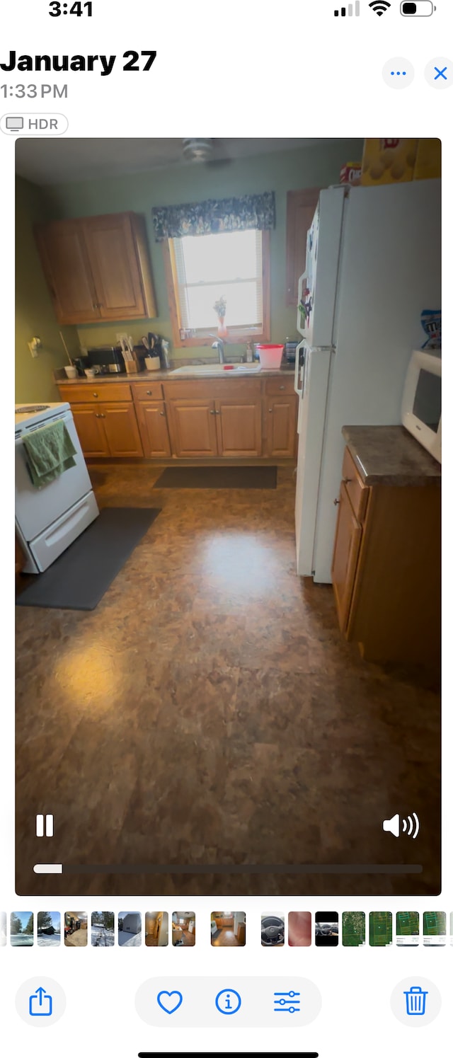 kitchen with white appliances and sink