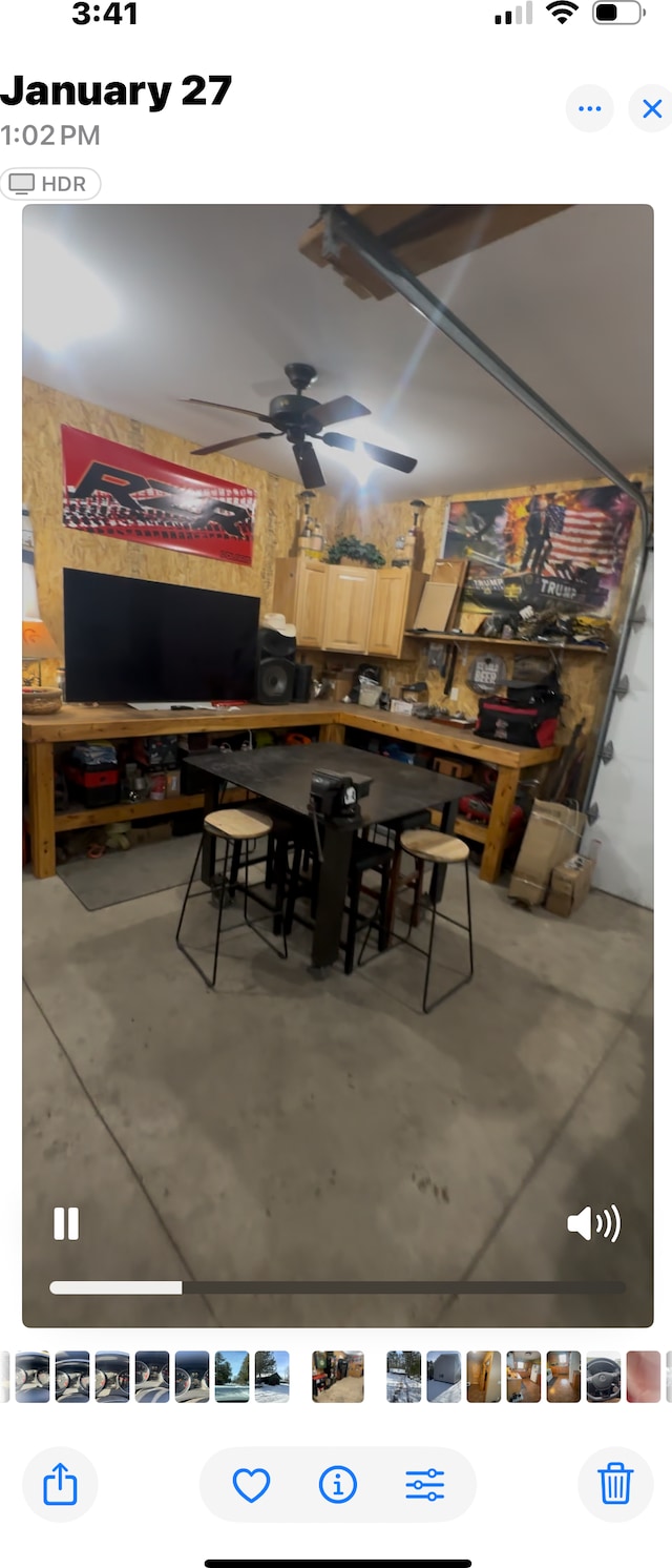 dining room featuring concrete flooring and ceiling fan