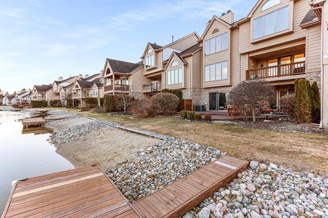 exterior space featuring a residential view and central AC