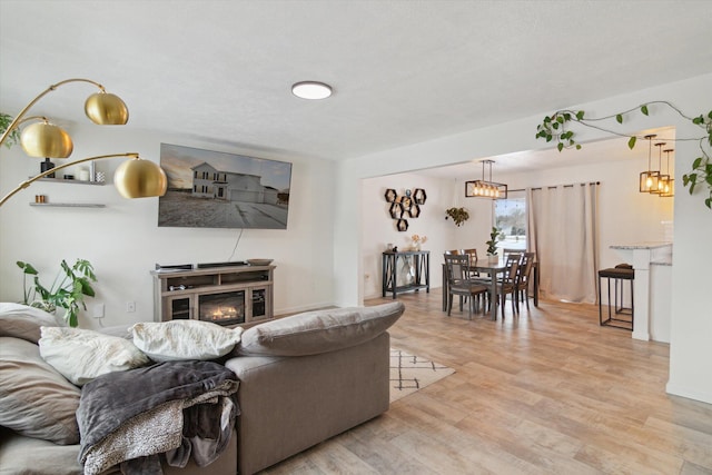 living room with light hardwood / wood-style flooring