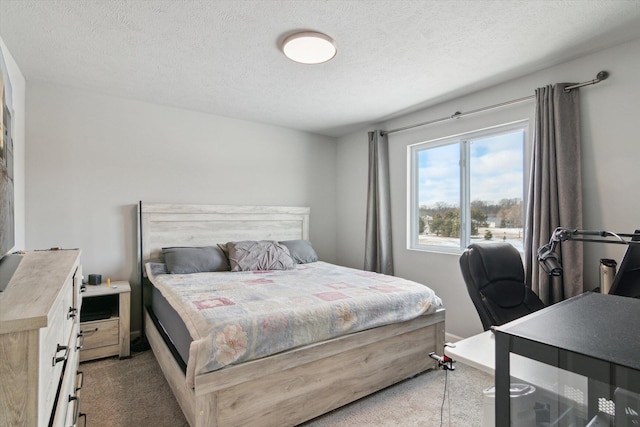 carpeted bedroom featuring a textured ceiling