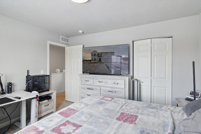 carpeted bedroom featuring a closet