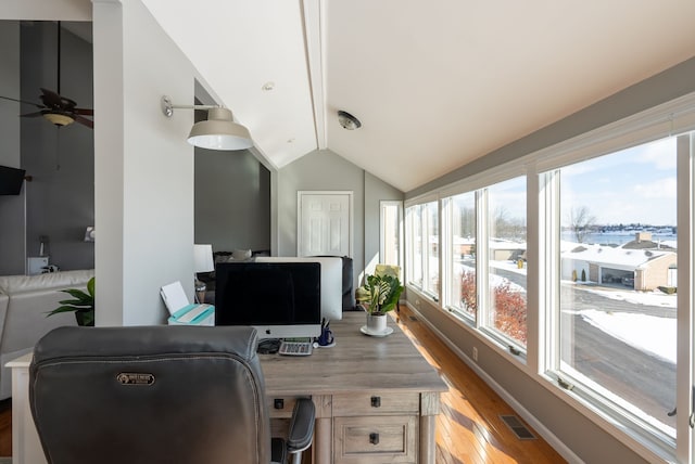 office featuring vaulted ceiling, ceiling fan, and light hardwood / wood-style flooring