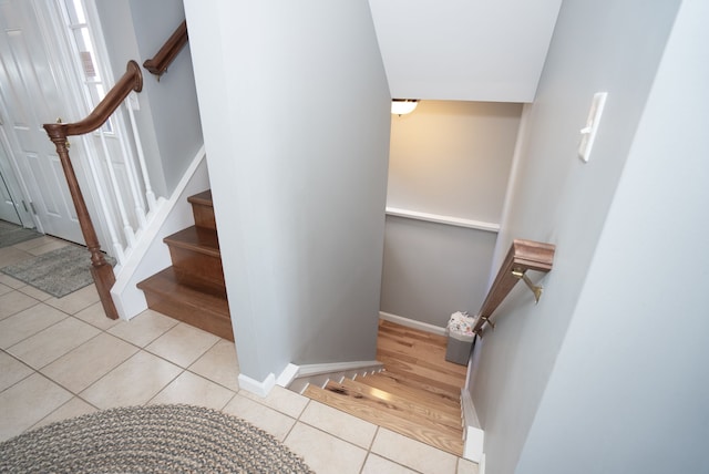 stairway featuring tile patterned floors