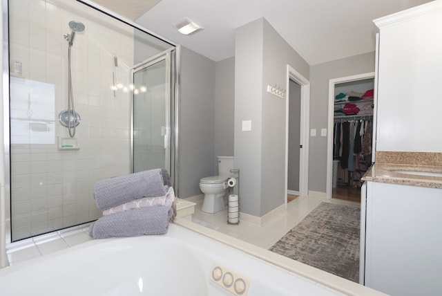 full bathroom with vanity, tile patterned floors, independent shower and bath, and toilet