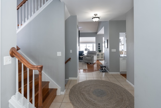 interior space featuring radiator heating unit and light tile patterned floors