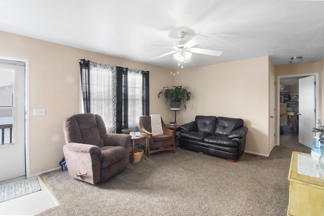 living room with carpet floors and ceiling fan