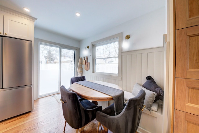 dining area with light hardwood / wood-style floors