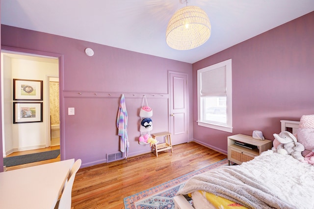 bedroom with light hardwood / wood-style floors