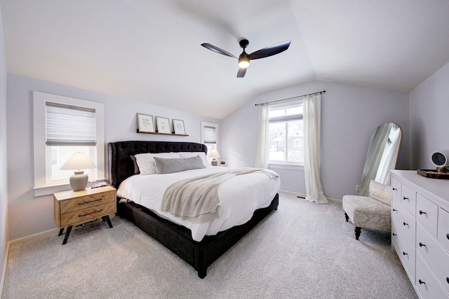 carpeted bedroom with lofted ceiling and ceiling fan