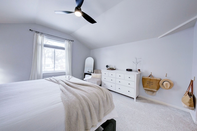 bedroom with lofted ceiling, light colored carpet, and ceiling fan