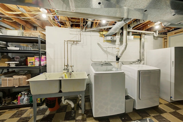 clothes washing area featuring washer and dryer