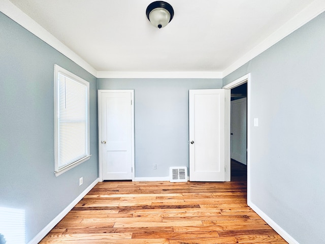 unfurnished bedroom with light hardwood / wood-style flooring