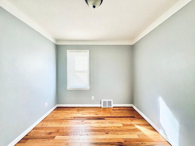 unfurnished room featuring light hardwood / wood-style floors