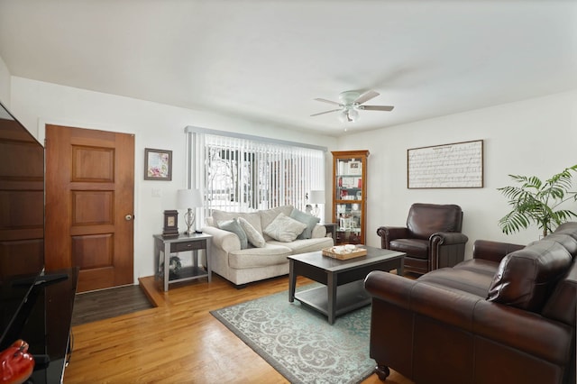 11870 Woodland Dr, Lennon, MI 48449 - living area featuring a ceiling fan and wood finished floors
