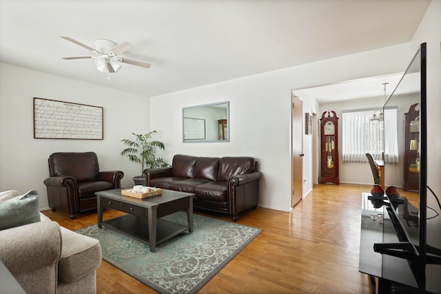 11870 Woodland Dr, Lennon, MI 48449 - living area with a ceiling fan and light wood finished floors