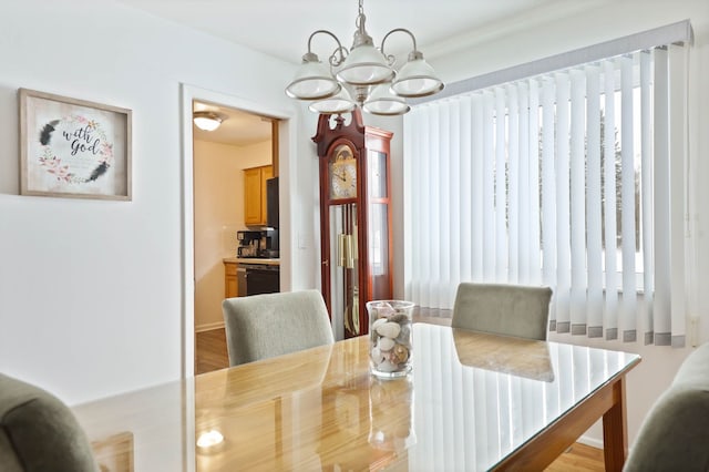 11870 Woodland Dr, Lennon, MI 48449 - dining space featuring a chandelier