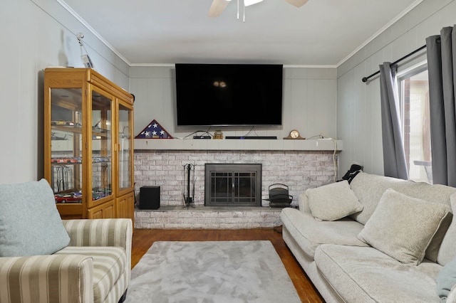 11870 Woodland Dr, Lennon, MI 48449 - living area with wood finished floors, crown molding, ceiling fan, a fireplace, and a decorative wall