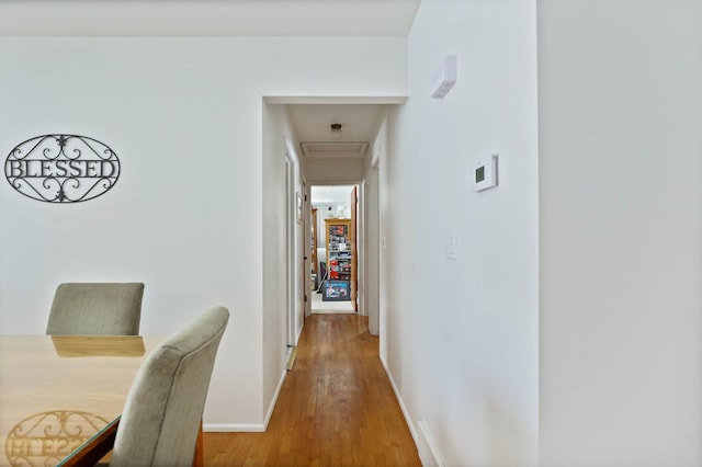11870 Woodland Dr, Lennon, MI 48449 - hallway with baseboards, light wood-type flooring, and attic access