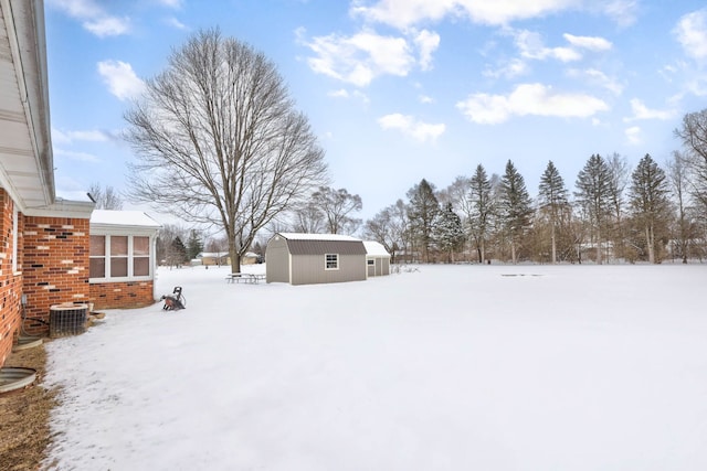 11870 Woodland Dr, Lennon, MI 48449 - snowy yard with cooling unit and an outdoor structure