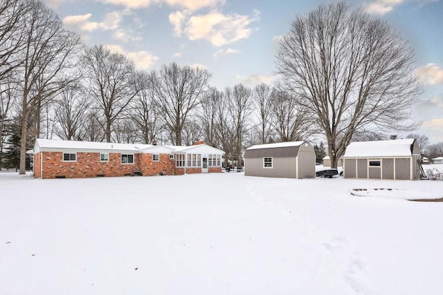 11870 Woodland Dr, Lennon, MI 48449 - snow covered back of property with an outdoor structure