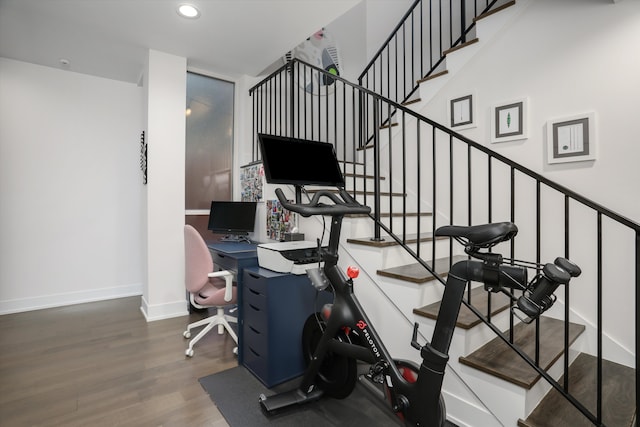 workout room featuring dark hardwood / wood-style flooring