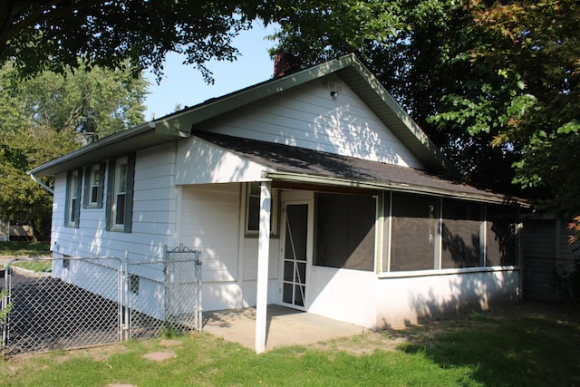 rear view of house featuring a patio