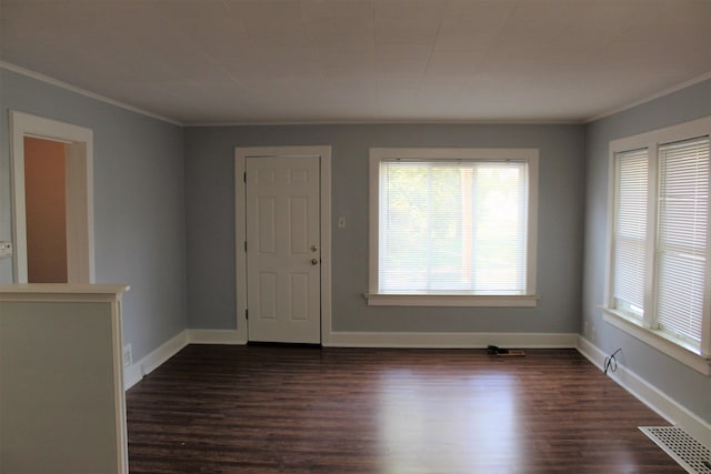 entryway with dark hardwood / wood-style flooring and ornamental molding