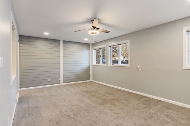 spare room with carpet floors and ceiling fan