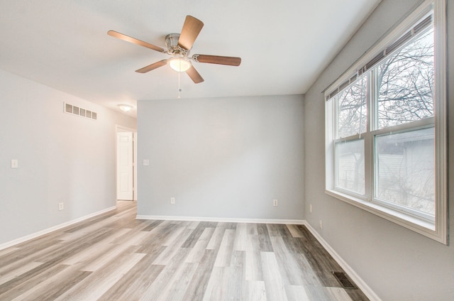 unfurnished room featuring ceiling fan and light wood-type flooring