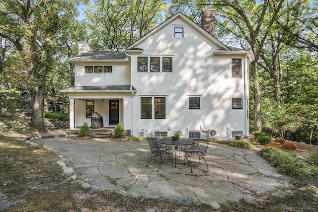 rear view of property with a patio area