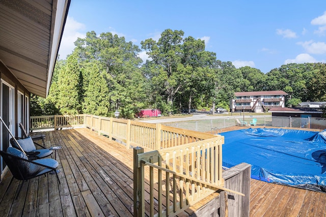 deck with a covered pool