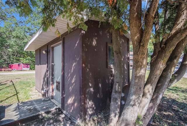 view of property exterior featuring a shed