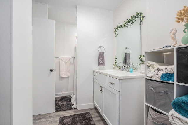 bathroom featuring vanity and hardwood / wood-style floors