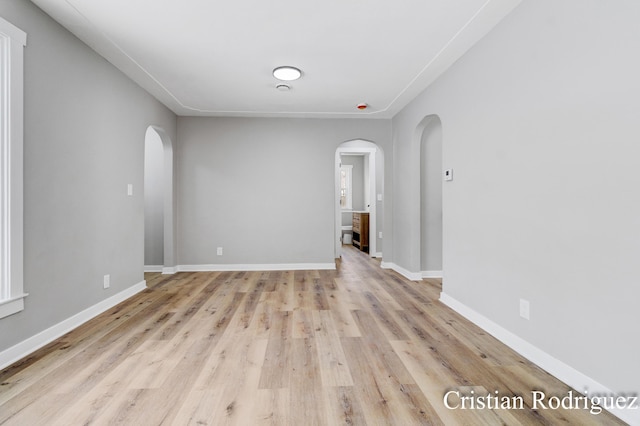 spare room with light hardwood / wood-style flooring