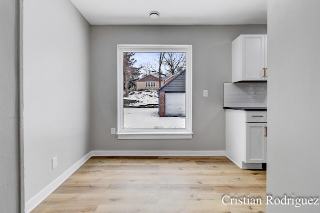 unfurnished dining area featuring light hardwood / wood-style floors