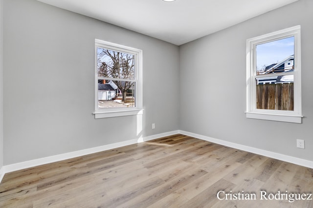 spare room with light wood-type flooring