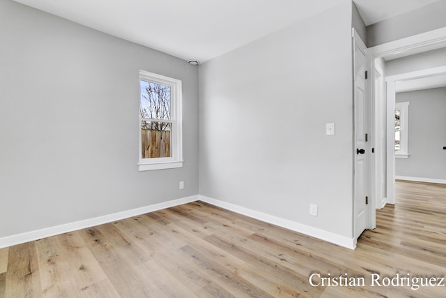 spare room featuring light hardwood / wood-style flooring