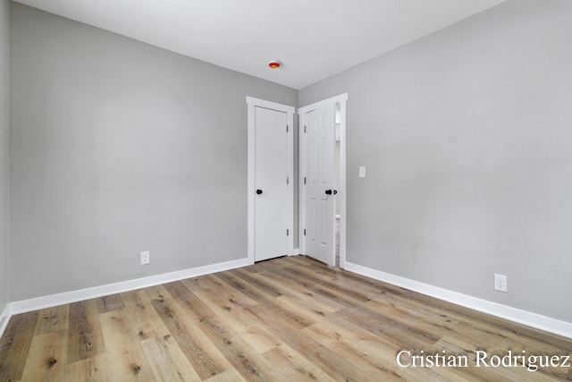 spare room with light wood-type flooring