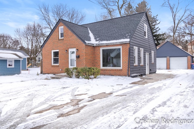 view of front facade with an outbuilding and a garage